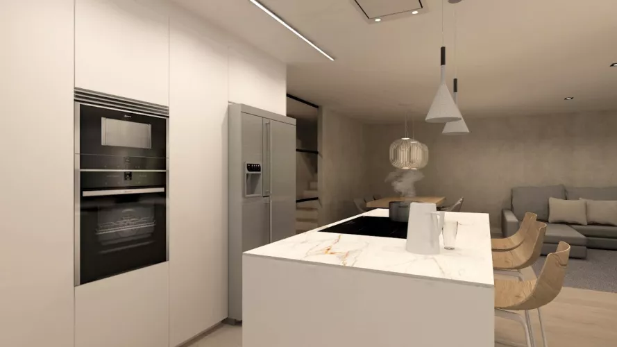 Cocina Santos blanca abierta al salón con encimera de Neolith